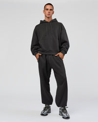 Man wearing Base Baggy Cuffed Track Pant - Onyx | Model:Albert | Size:M | Thumbnail Index: 2