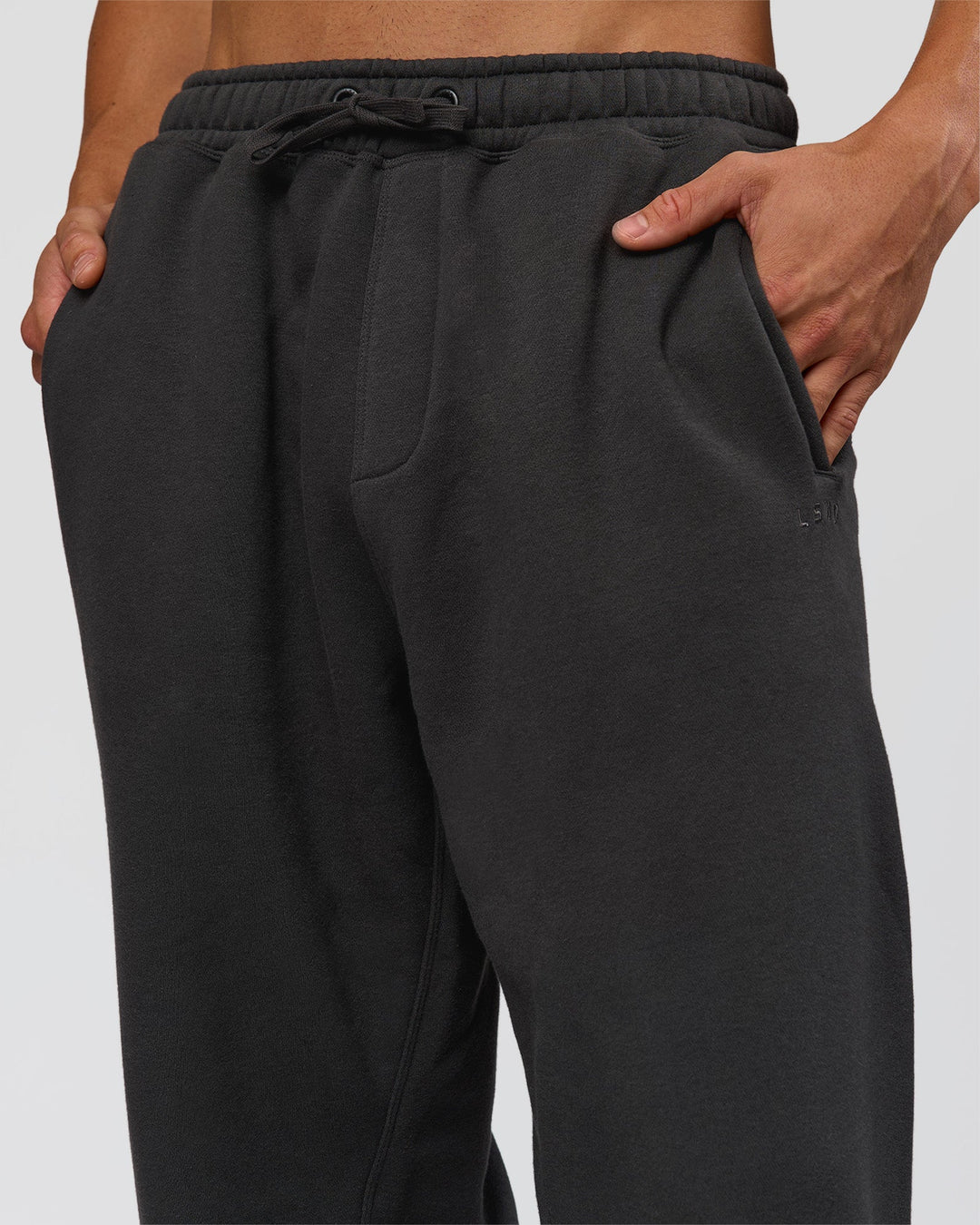 Man wearing Base Baggy Cuffed Track Pant - Onyx | Model:Albert | Size:M - view 5
