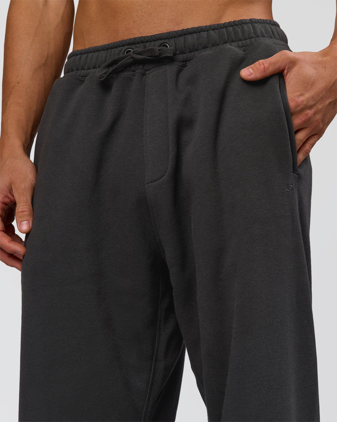 Man wearing Base Baggy Cuffed Track Pant - Onyx | Model:Albert | Size:M - view 6