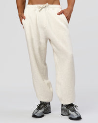 Man wearing Base Baggy Cuffed Track Pant - Silver Marl | Model:Albert | Size:M | Thumbnail Index: 0