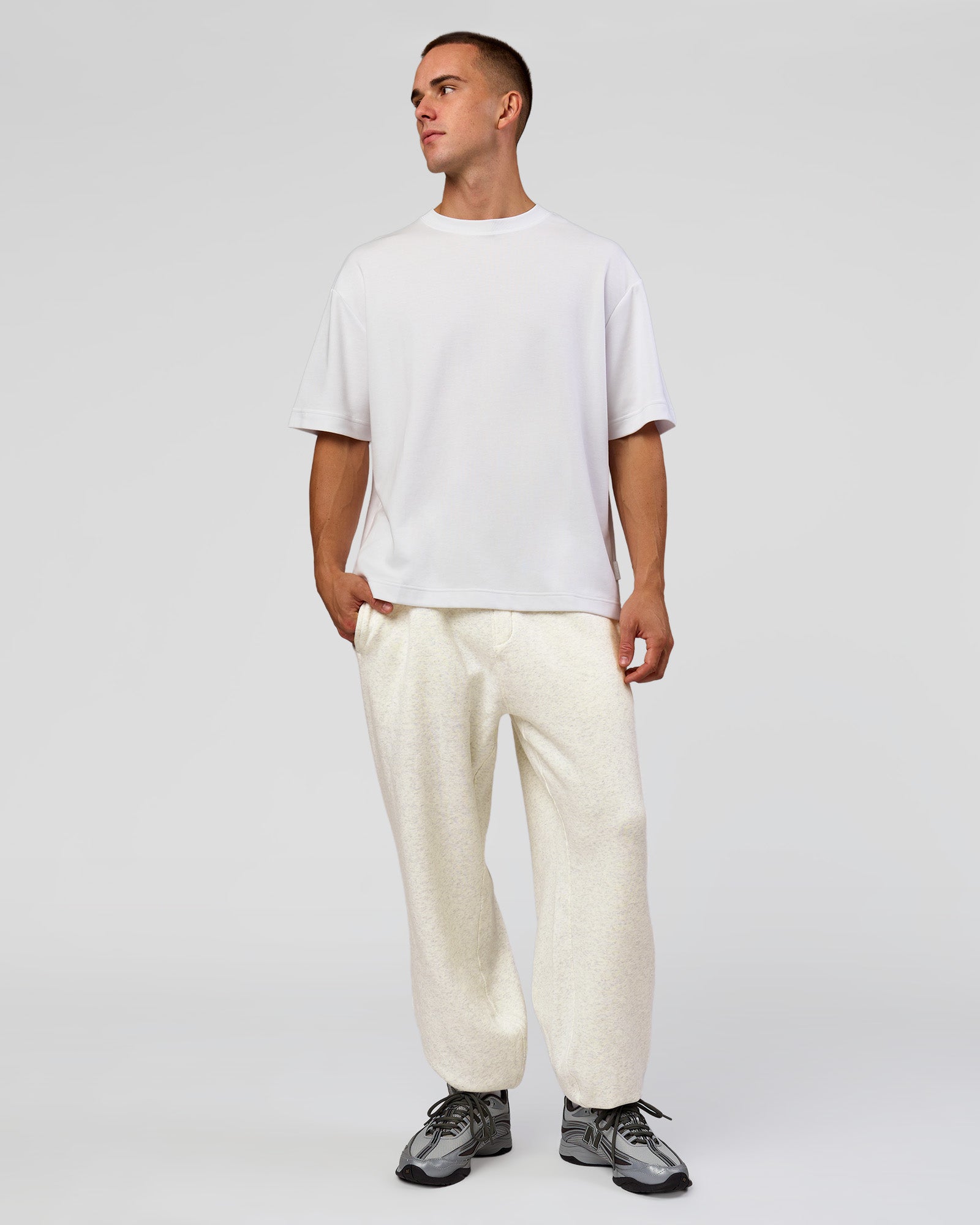 Man wearing Base Baggy Cuffed Track Pant - Silver Marl | Model:Albert | Size:M