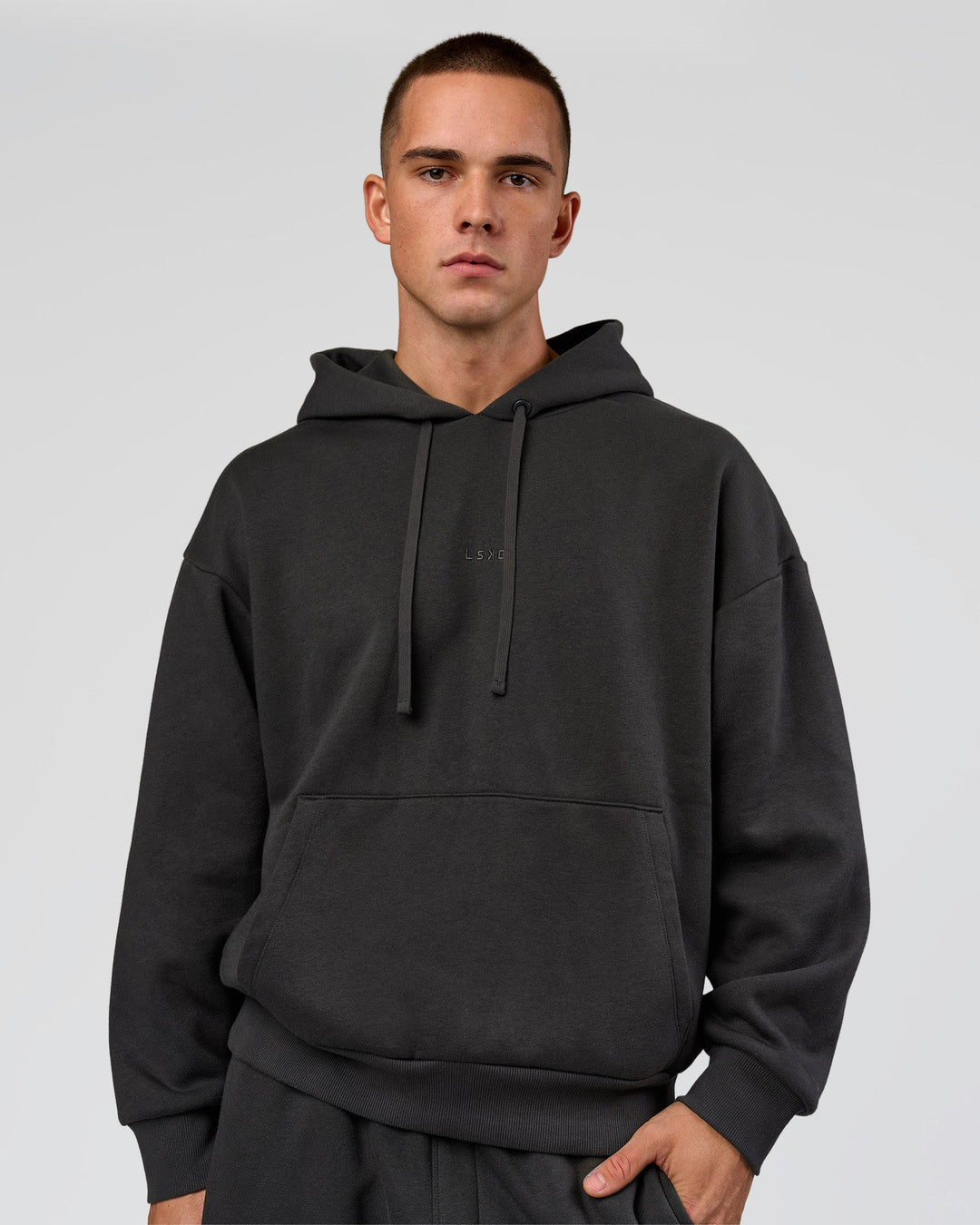 Man wearing Base Oversized DC Hoodie - Onyx | Model:Albert | Size:M - view 4