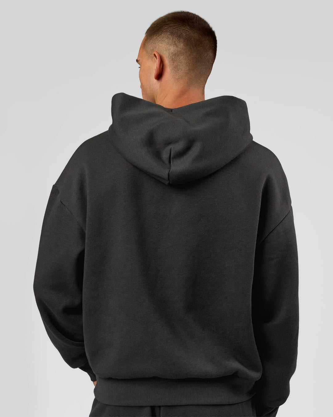 Man wearing Base Oversized DC Hoodie - Onyx | Model:Albert | Size:M - view 5
