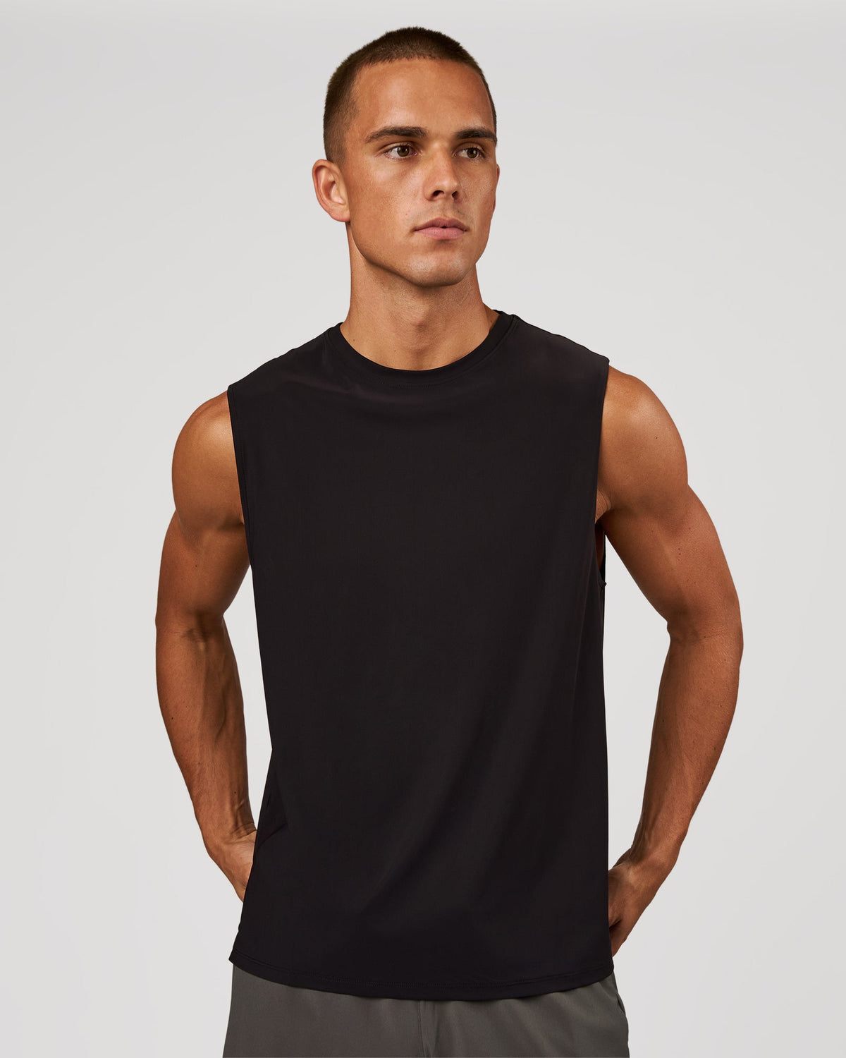 Man wearing Cadence Swift Muscle Tank - Black | Model:Albert | Size:M
