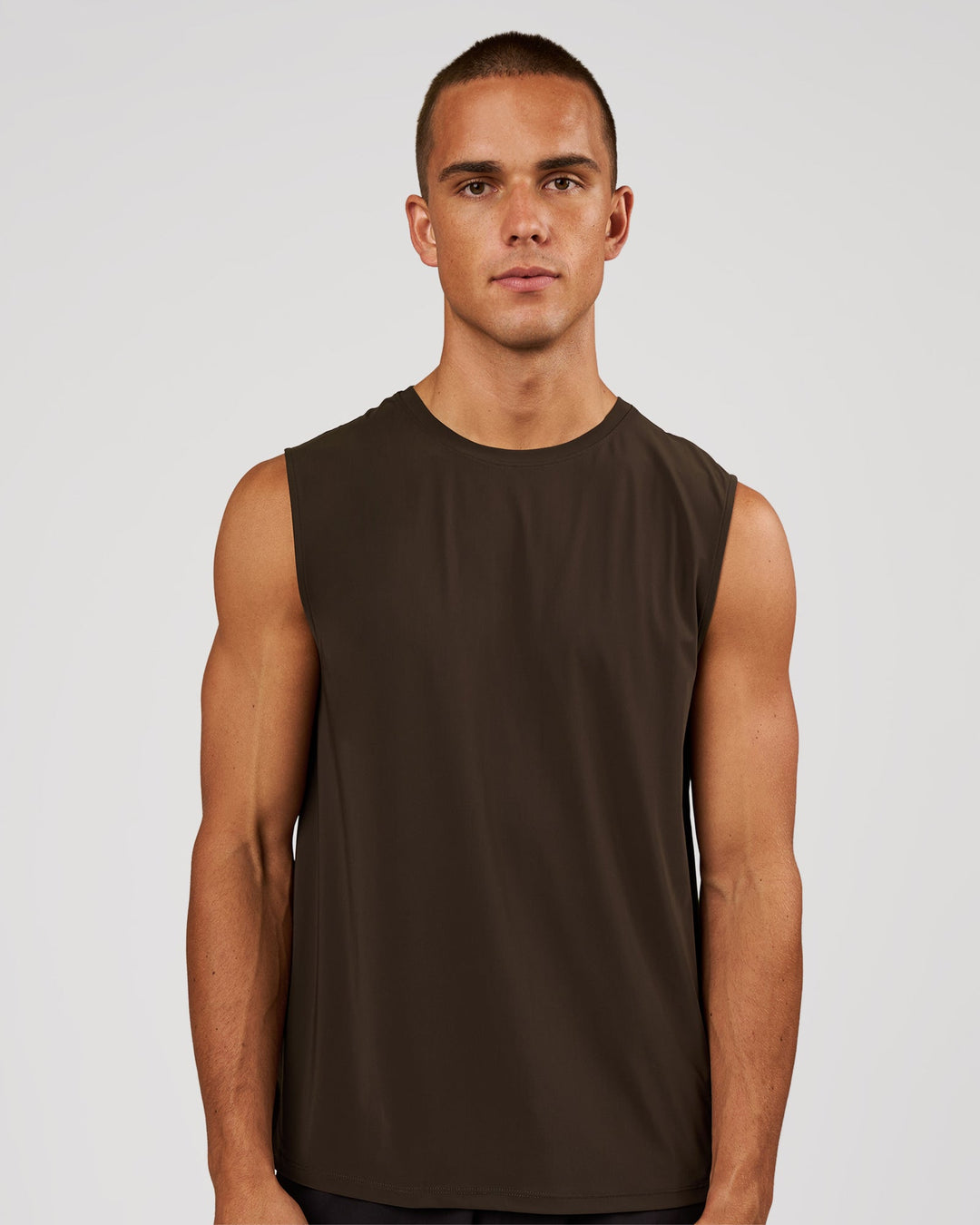 Man wearing Cadence Swift Muscle Tank - Ground Coffee | Model:Albert | Size:M - view 1