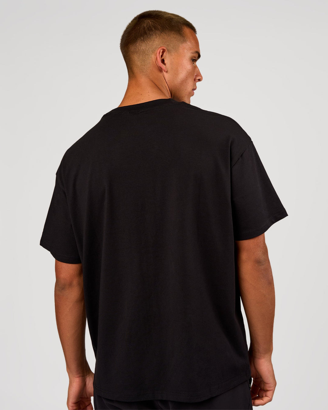 Man wearing Game Plan Heavyweight FLXCotton Oversized Tee - Black | Model:Albert | Size:M - view 4