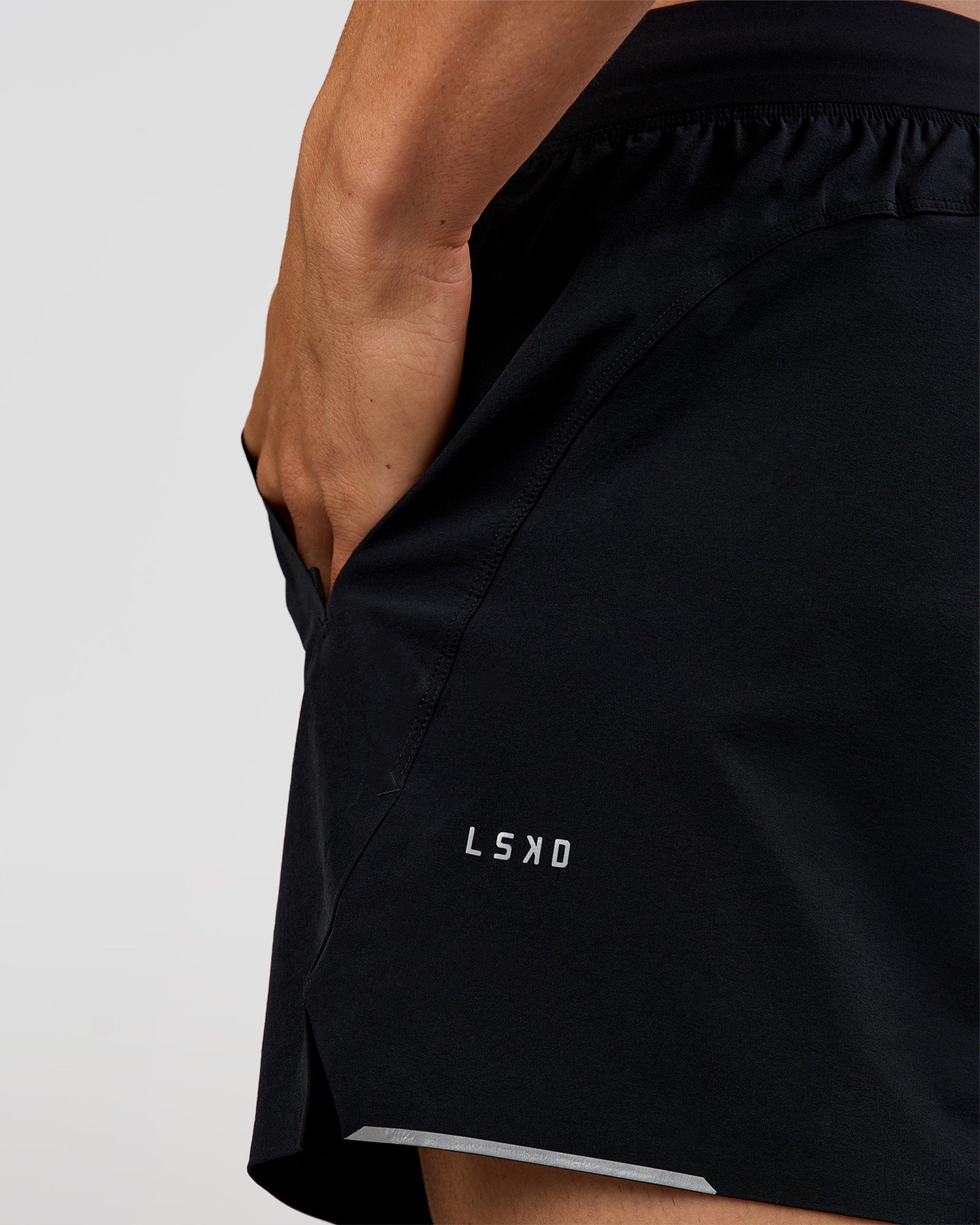 Man wearing Hybrid 5" Short - Black-Reflective | Model:Albert | Size:M