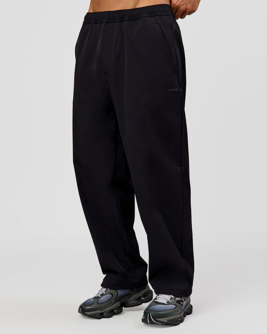 Man wearing Motion Wide Leg Pant - Black | Model:Albert | Size:M - view 1