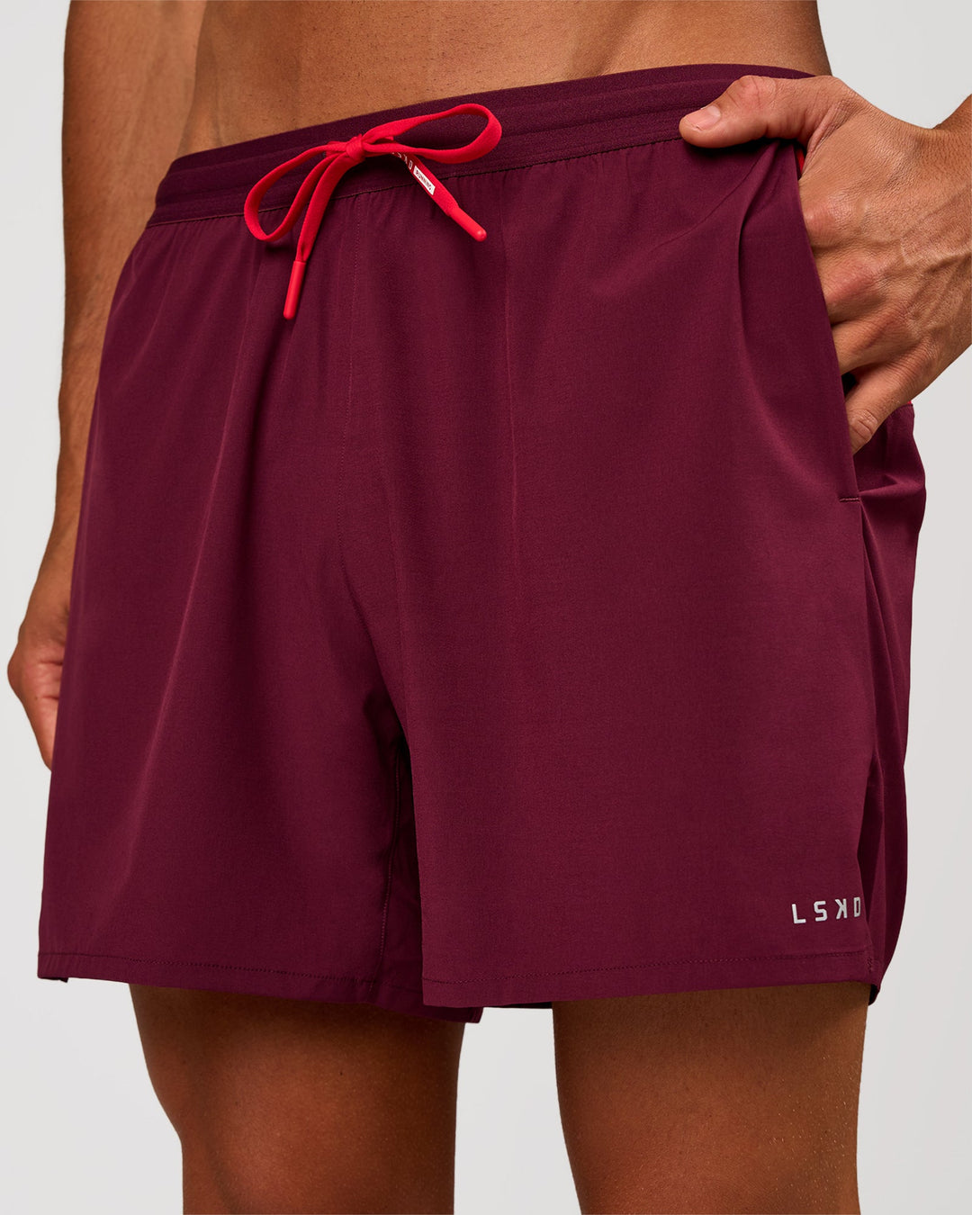 Man wearing Pace 5" Lined Running Short - Cherry Lacquer-Scarlet | Model:Albert | Size:M - view 2