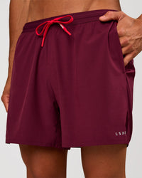 Man wearing Pace 5" Lined Running Short - Cherry Lacquer-Scarlet | Model:Albert | Size:M | Thumbnail Index: 1