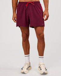 Man wearing Pace 5" Lined Running Short - Cherry Lacquer-Scarlet | Model:Albert | Size:M | Thumbnail Index: 5