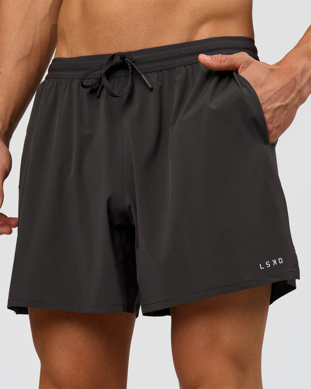 Man wearing Pace 5" Running Short - Black-Onyx | Model:Albert | Size:M - view 1