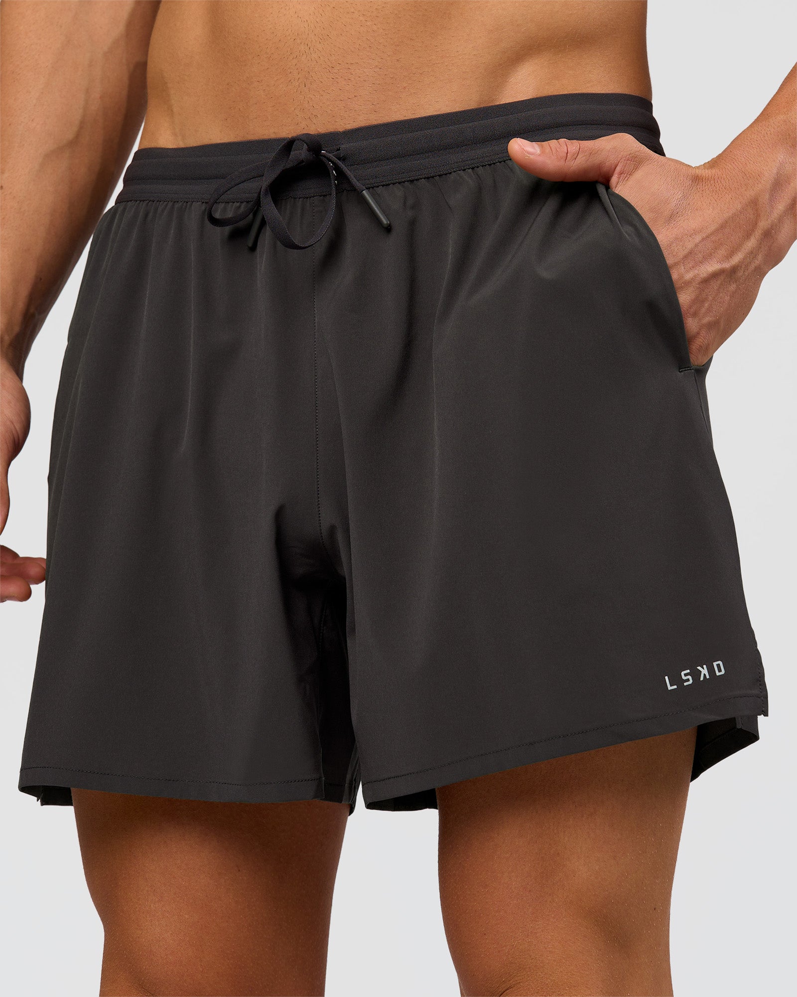 Man wearing Pace 5" Running Short - Black-Onyx | Model:Albert | Size:M