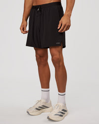 Man wearing Pace 7" Lined Running Short - Black-Reflective | Model:Albert | Size:M | Thumbnail Index: 6
