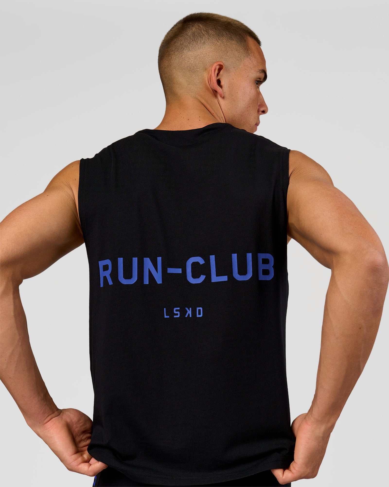 Man wearing Run Club FLXCotton Tank - Black-Electric Indigo | Model:Albert | Size:M