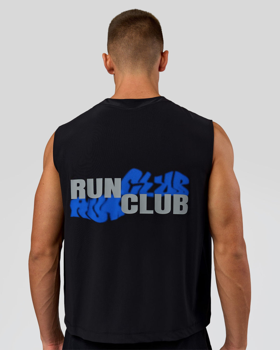 Man wearing Run Club Elevate Muscle Tank - Black-Electric Indigo | Model:Albert | Size:M - view 4