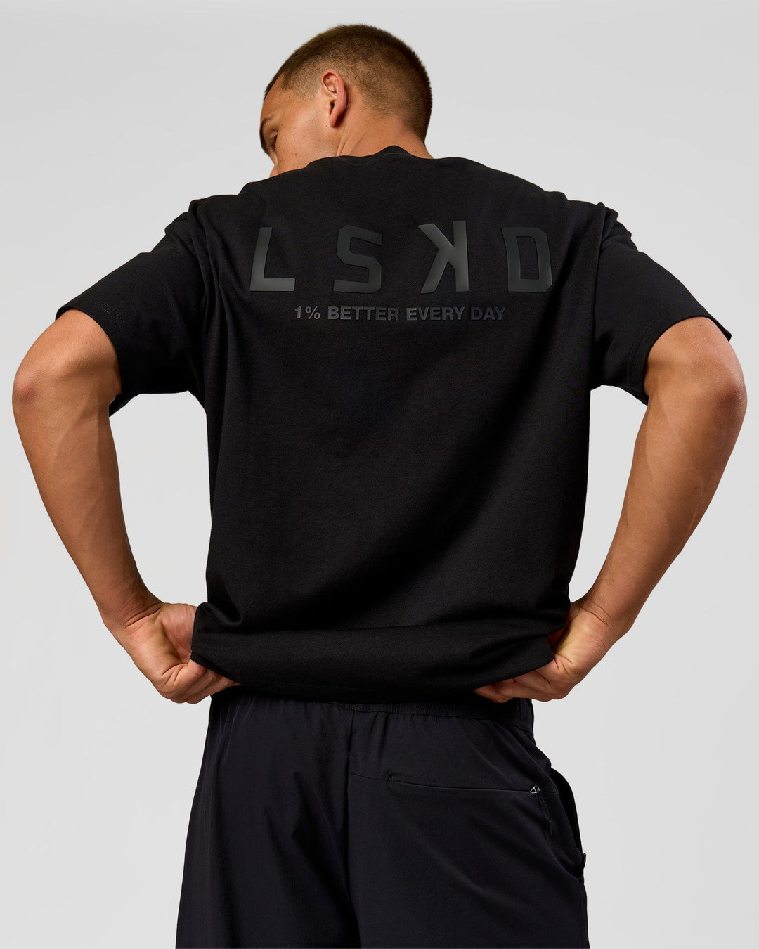 Man wearing Tonal Legacy Heavyweight Oversized Tee - Black-Black | Model:Albert | Size:M - view 11
