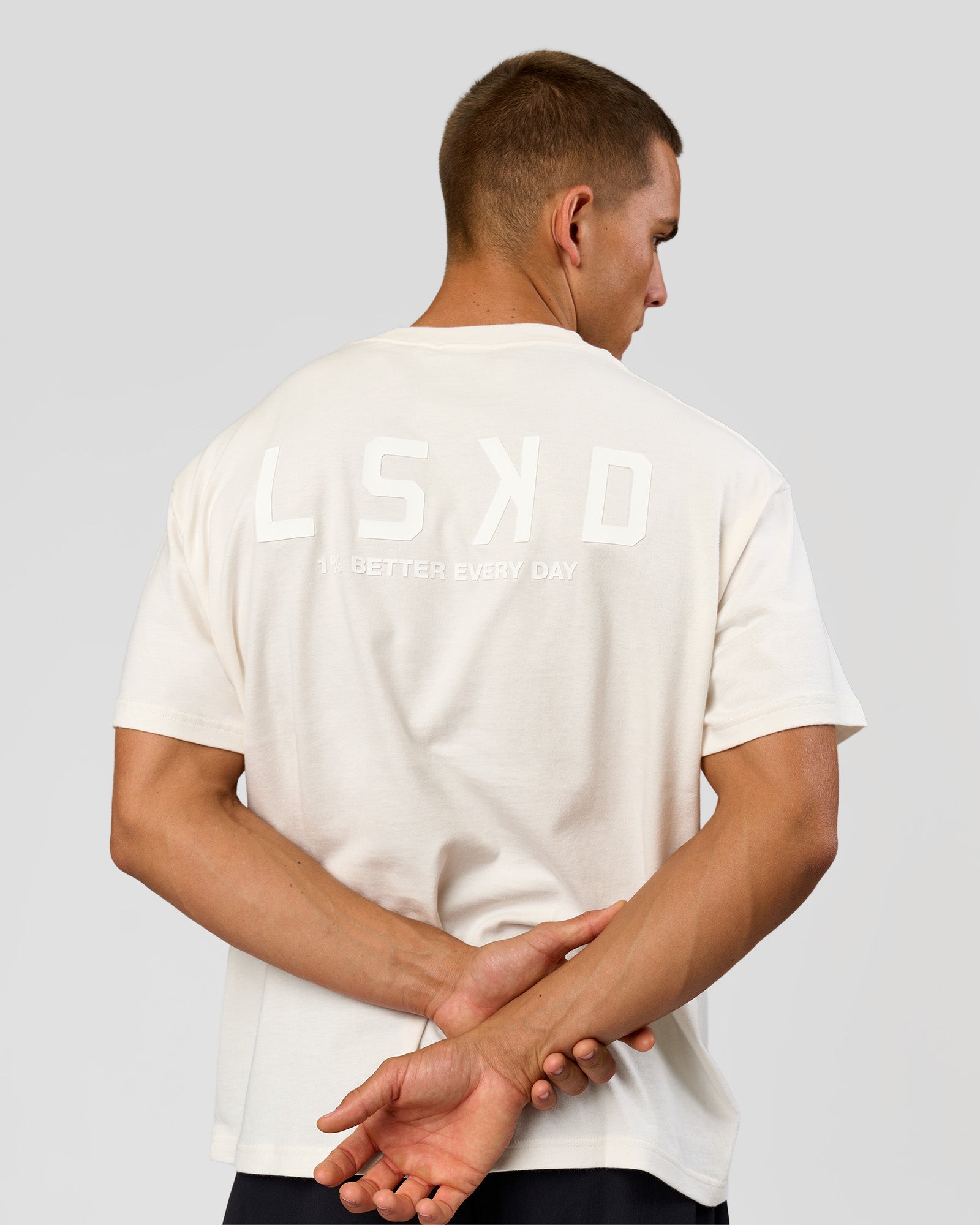 Man wearing Tonal Legacy Heavyweight Oversized Tee - Off White-Off White | Model:Albert | Size:M