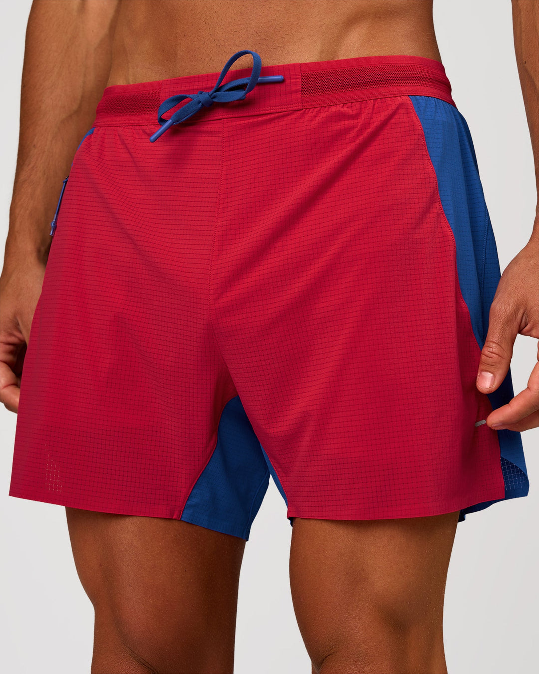 Man wearing UltraAir 5" Lined Performance Short - Scarlet-Electric Indigo | Model: Albert | Size: M - view 1