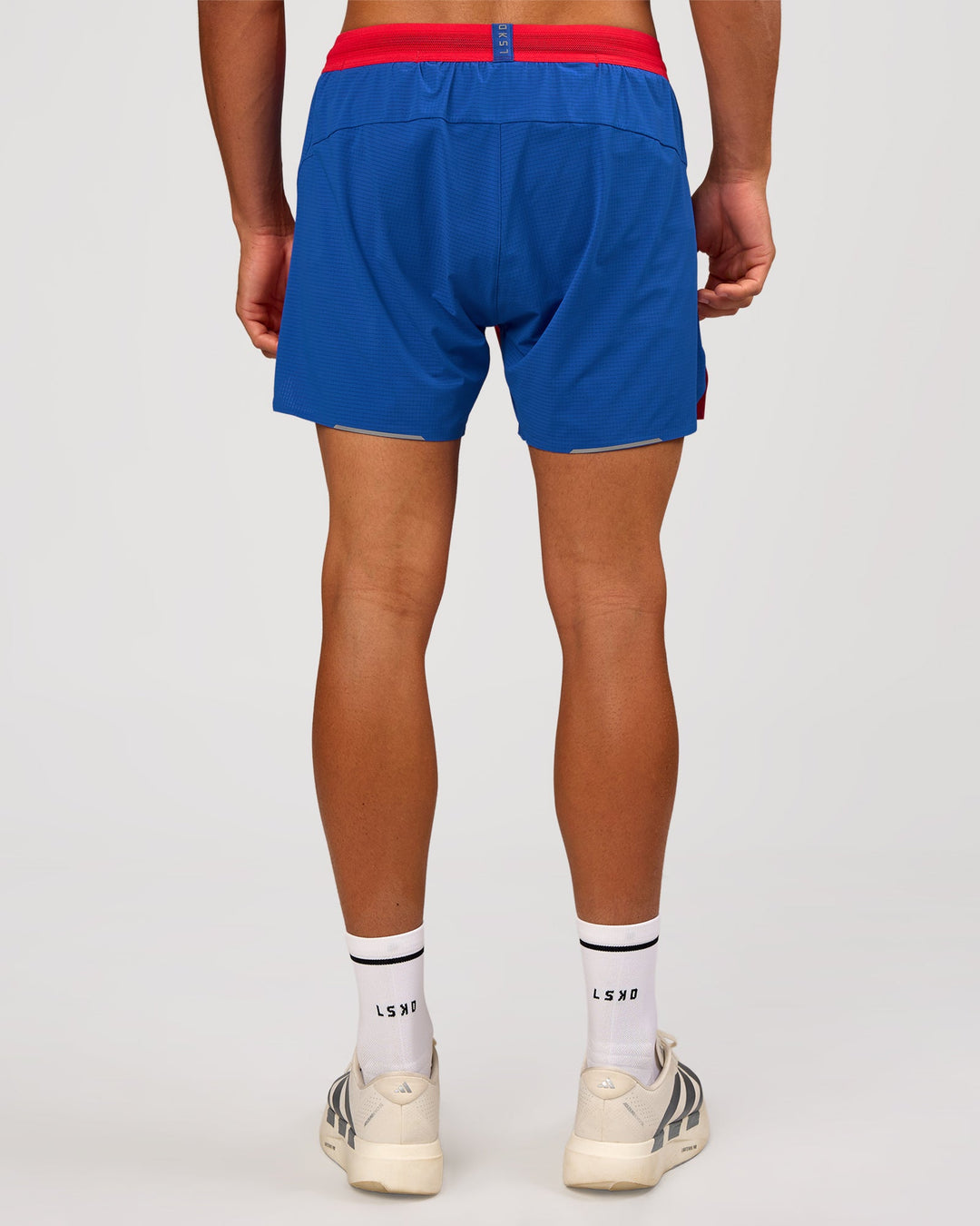 Man wearing UltraAir 5" Lined Performance Short - Scarlet-Electric Indigo | Model: Albert | Size: M - view 4