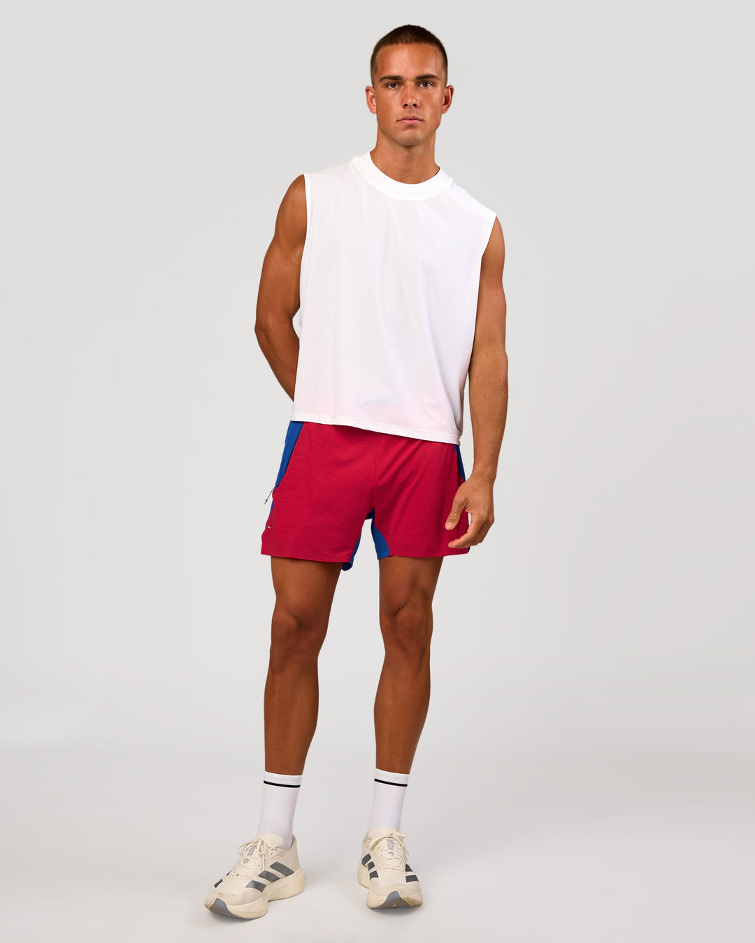 Man wearing UltraAir 5" Lined Performance Short - Scarlet-Electric Indigo | Model: Albert | Size: M - view 10