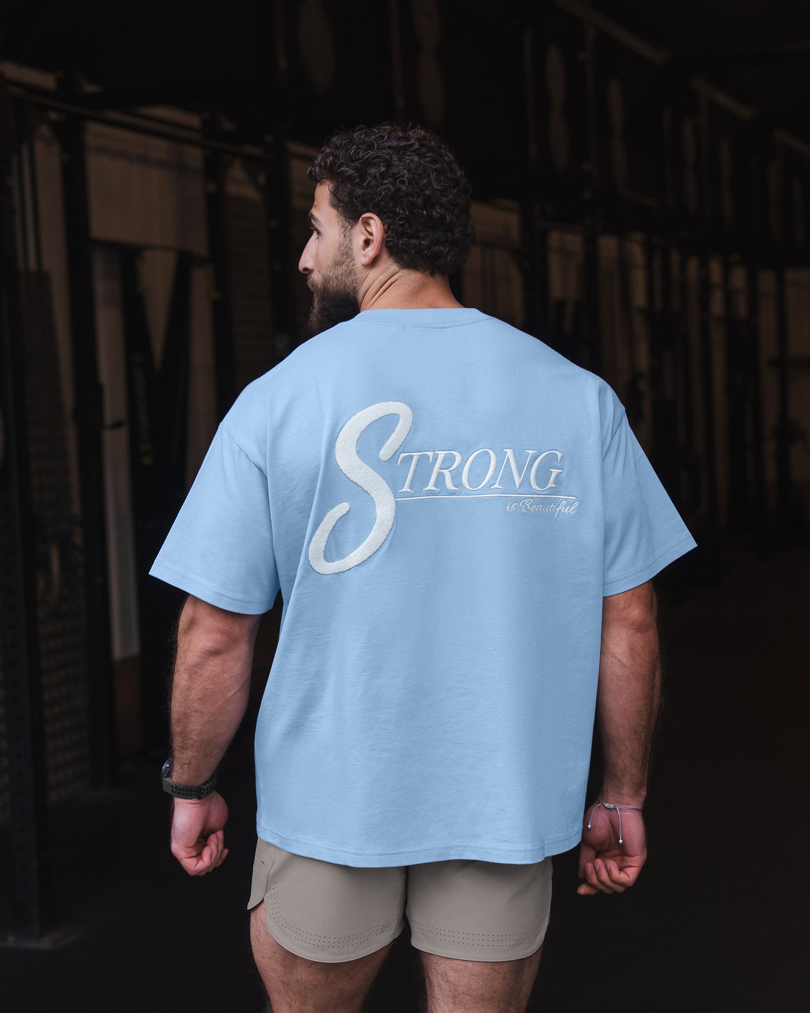 Man wearing Strong is Beautiful Heavyweight Oversized Tee - Open Air | Model:Fod | Size:M