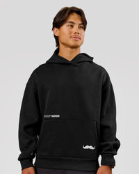 Man wearing Movember x LSKD Oversized Hoodie - Black | Model:George | Size:M | Thumbnail Index: 1