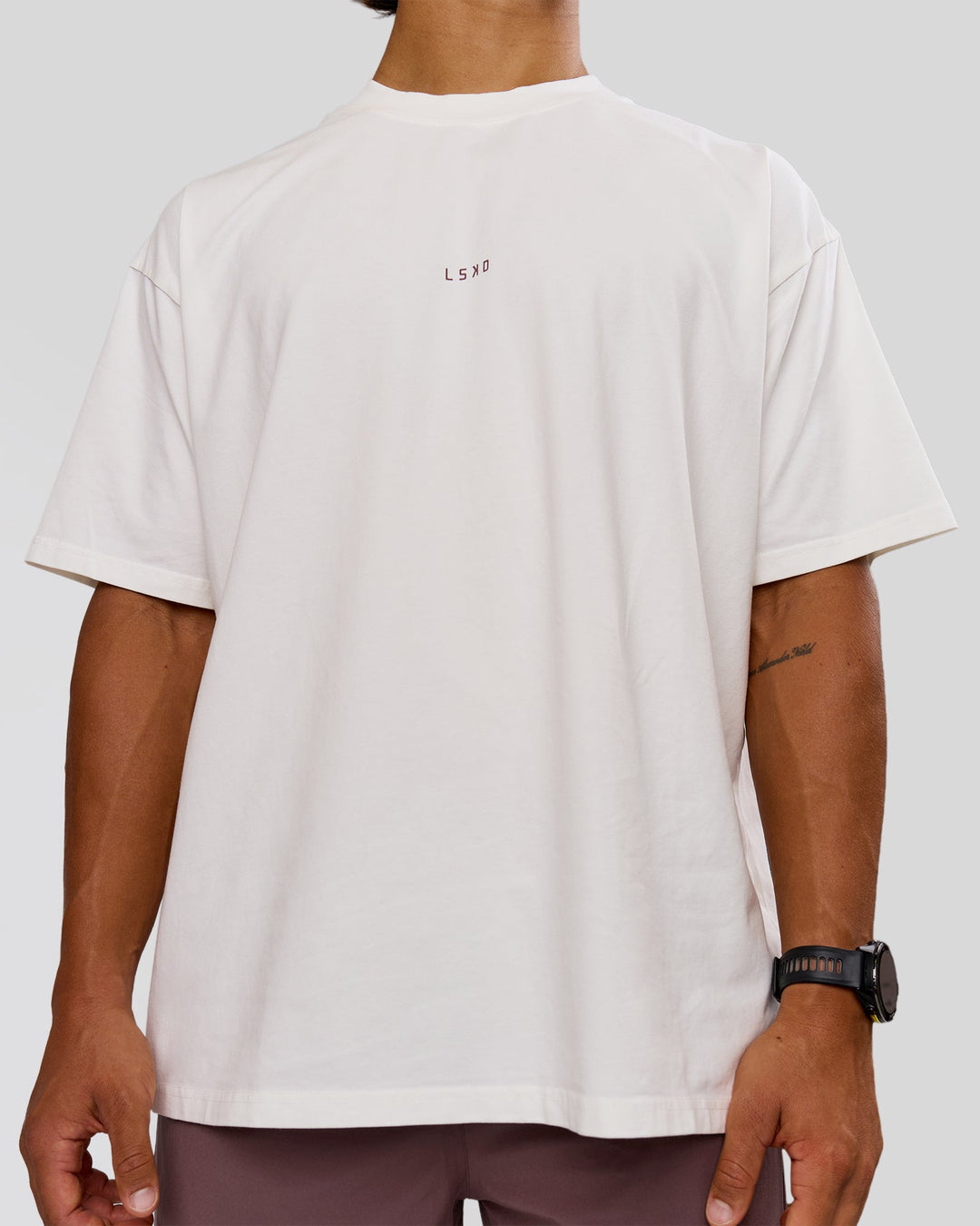 Man wearing Run Club Unisex Oversized Heavyweight FLXCotton Tee - Off White | Model:George | Size:M - view 3