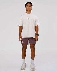 Man wearing Run Club Unisex Oversized Heavyweight FLXCotton Tee - Off White | Model:George | Size:M | Thumbnail Index: 4