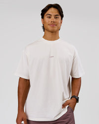 Man wearing Run Club Unisex Oversized Heavyweight FLXCotton Tee - Off White | Model:George | Size:M | Thumbnail Index: 3