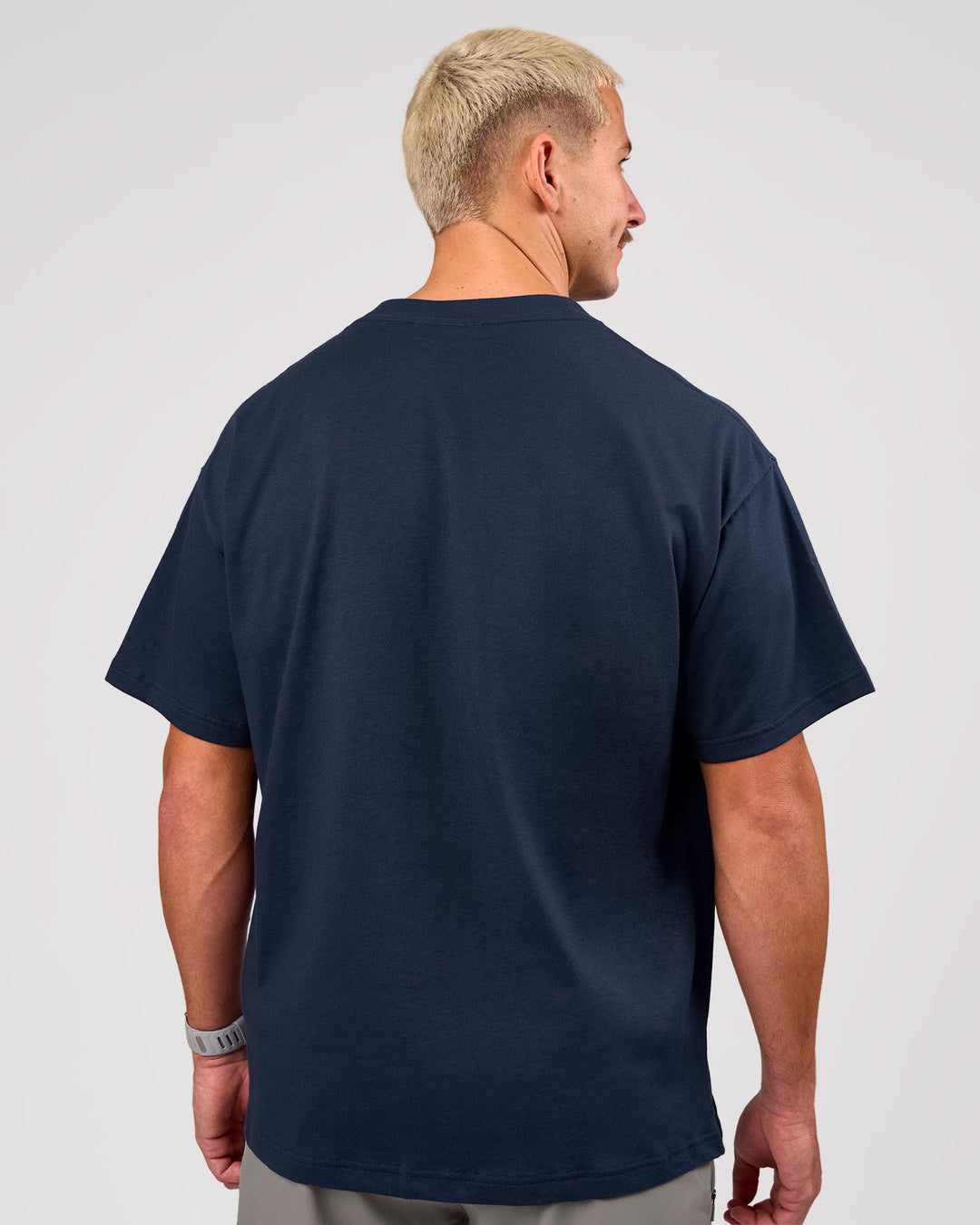 Man wearing Varsity EST Heavyweight Oversized Tee  - Future Navy-White | Model:Jaiden | Size:M - view 10