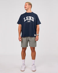 Man wearing Varsity EST Heavyweight Oversized Tee  - Future Navy-White | Model:Jaiden | Size:M | Thumbnail Index: 11