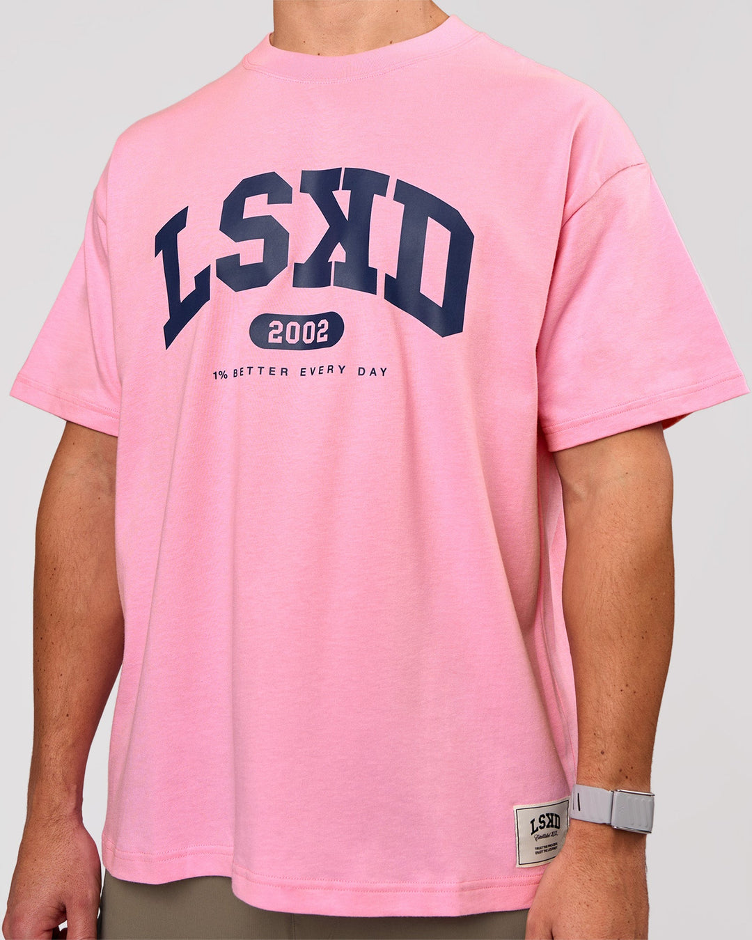 Man wearing Varsity EST Heavyweight Oversized Tee  - Pink Rose-Future Navy | Model:Jaiden | Size:M - view 10