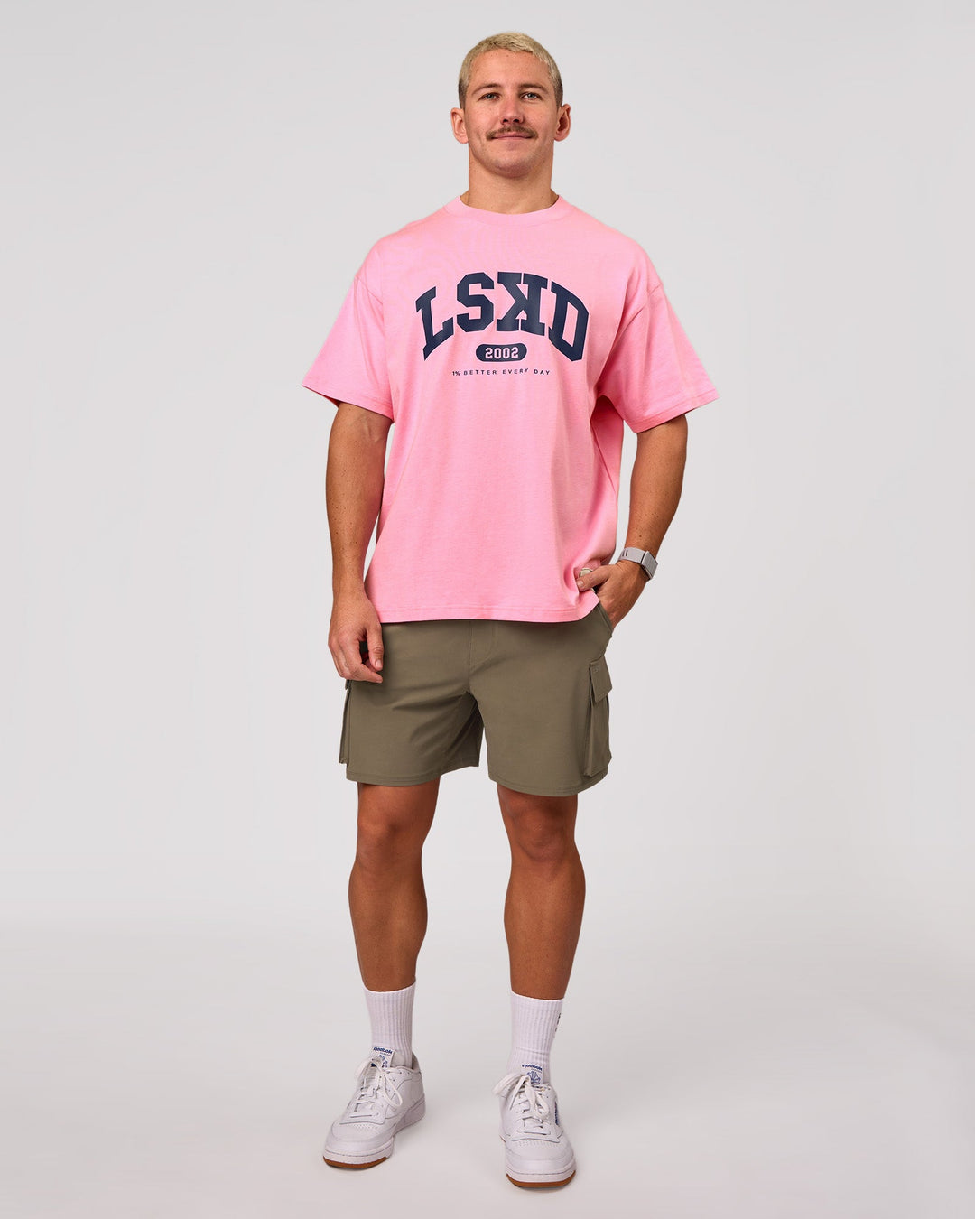 Man wearing Varsity EST Heavyweight Oversized Tee  - Pink Rose-Future Navy | Model:Jaiden | Size:M - view 12