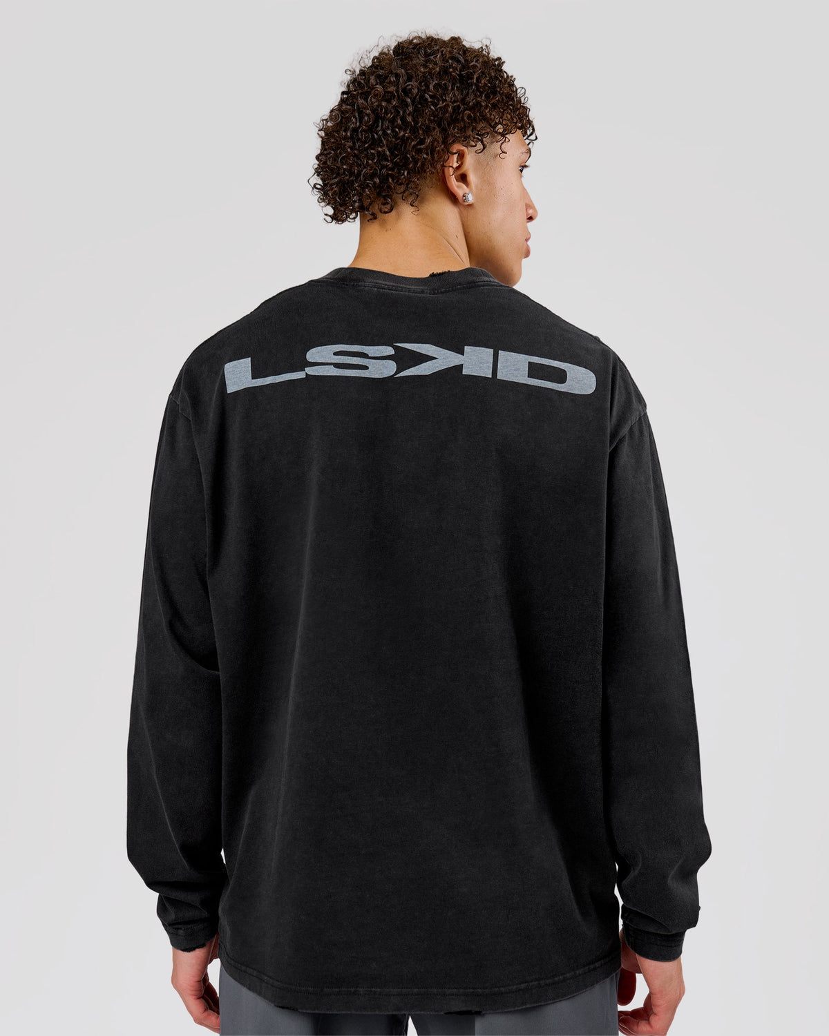 Man wearing Backline Washed Heavyweight Oversized LS Tee - Black Washed | Model:Leandro | Size:M - view 1