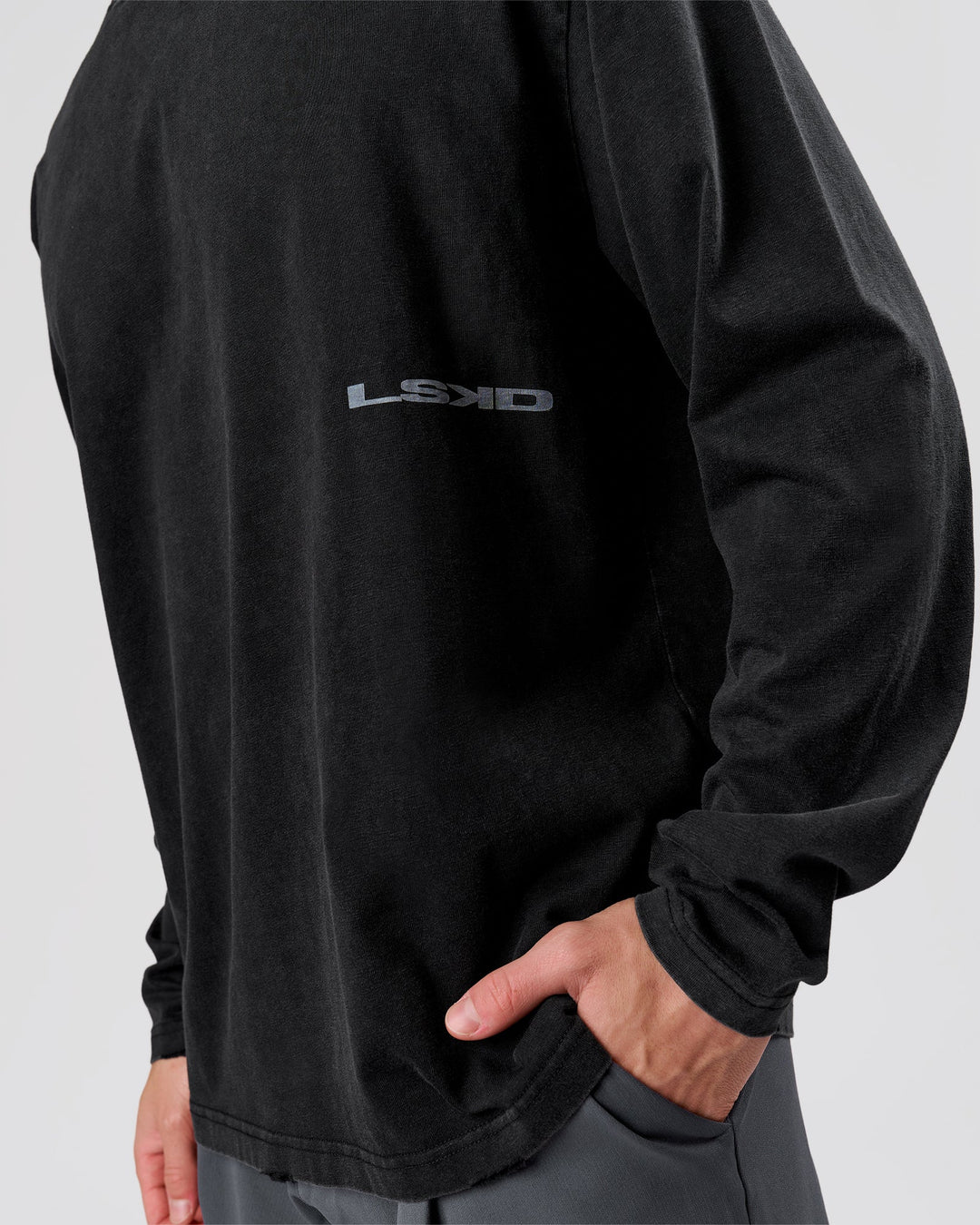 Man wearing Backline Washed Heavyweight Oversized LS Tee - Black Washed | Model:Leandro | Size:M - view 3