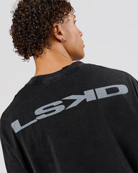 Man wearing Backline Washed Heavyweight Oversized LS Tee - Black Washed | Model:Leandro | Size:M | Thumbnail Index: 6