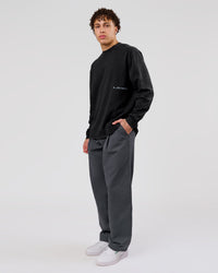 Man wearing Backline Washed Heavyweight Oversized LS Tee - Black Washed | Model:Leandro | Size:M | Thumbnail Index: 10