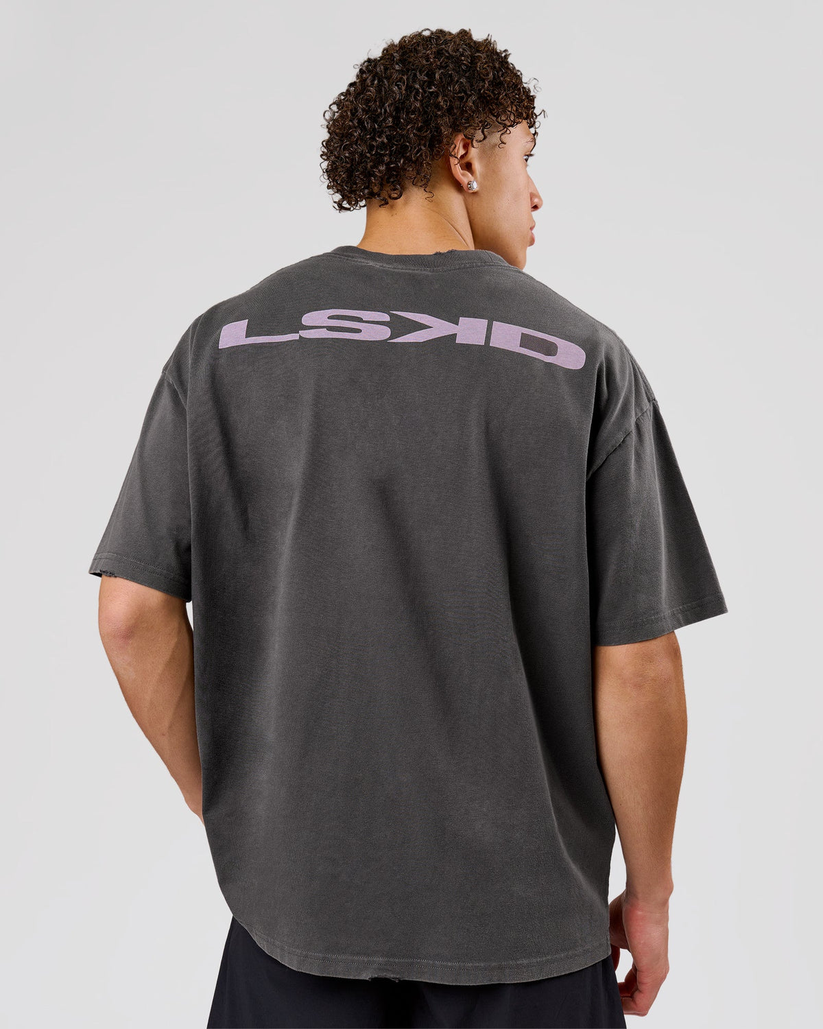 Man wearing Backline Washed Heavyweight Oversized Tee - Asphalt Washed | Model:Leandro | Size:M - view 1