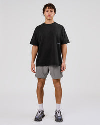 Man wearing Backline Washed Heavyweight Oversized Tee - Black Washed | Model:Leandro | Size:M | Thumbnail Index: 9