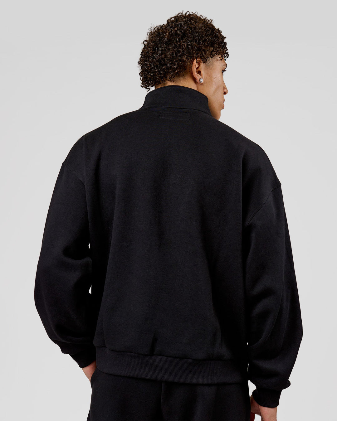 Man wearing Base Quarter Zip Sweater - Black | Model:Leandro | Size:M - view 2