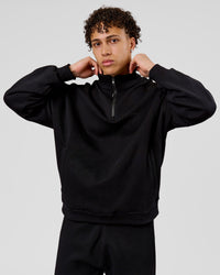 Man wearing Base Quarter Zip Sweater - Black | Model:Leandro | Size:M | Thumbnail Index: 2