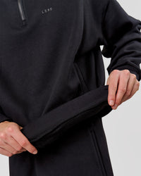Man wearing Base Quarter Zip Sweater - Black | Model:Leandro | Size:M | Thumbnail Index: 7