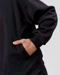 Man wearing Base Quarter Zip Sweater - Black | Model:Leandro | Size:M | Thumbnail Index: 10