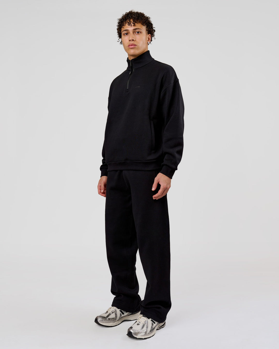 Man wearing Base Quarter Zip Sweater - Black | Model:Leandro | Size:M - view 13