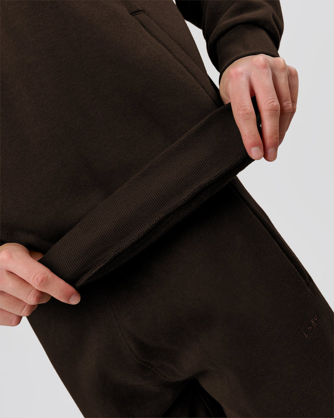 Man wearing Base Quarter Zip Sweater - Ground Coffee | Model:Leandro | Size:M - view 9