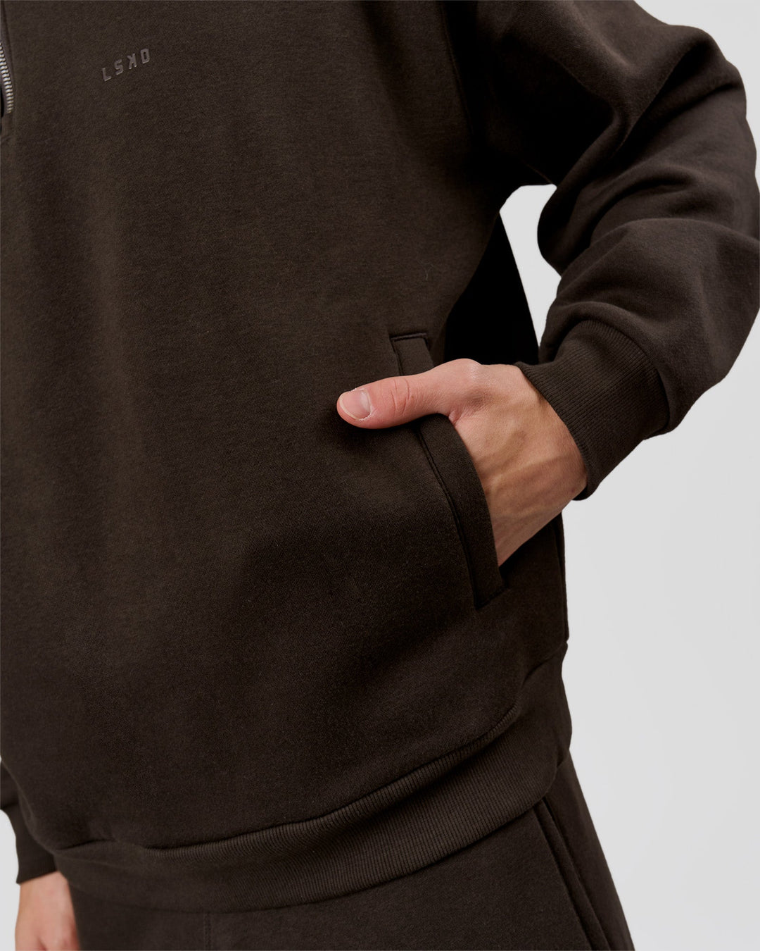 Man wearing Base Quarter Zip Sweater - Ground Coffee | Model:Leandro | Size:M - view 10
