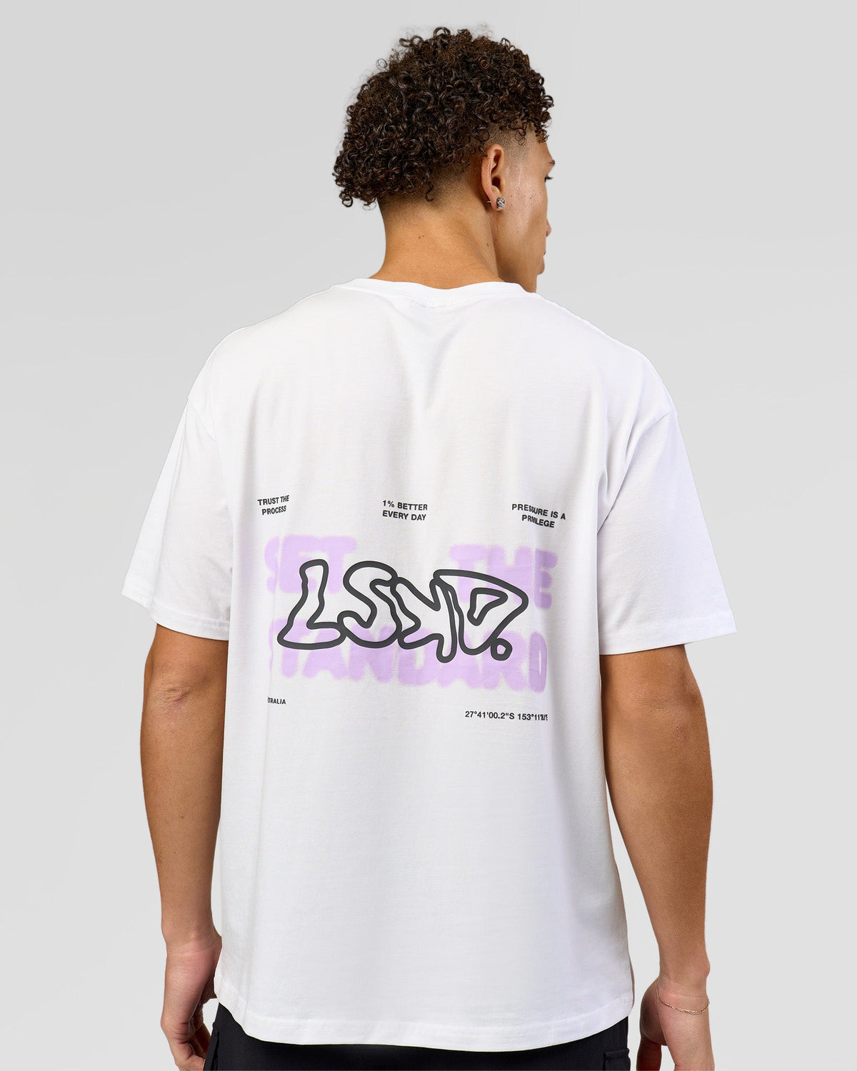 Man wearing Benchmark FLXCotton Oversized Tee - White-Pale Lilac | Model:Leandro | Size:M