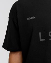 Man wearing Game Plan Heavyweight FLXCotton Oversized Tee - Black | Model:Leandro | Size:M | Thumbnail Index: 11