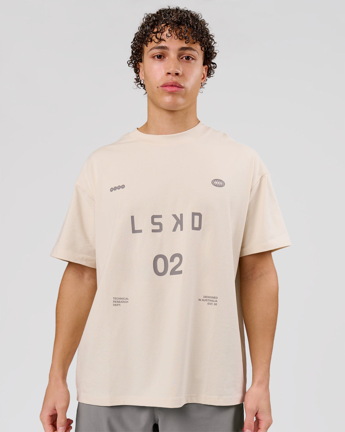 Man wearing Game Plan Heavyweight FLXCotton Oversized Tee - Vanilla Bean | Model:Leandro | Size:M - view 1